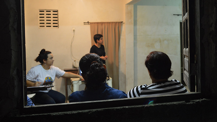 A group of women gather to talk about domestic violence, housing, and property rights in Recife, Brazil