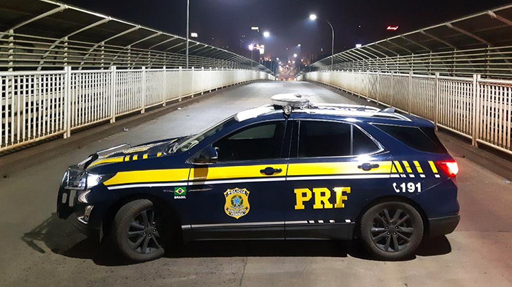 A patrol unit of Brazil's Federal Highway Police sits blocking the Friendship Bridge between Paraguay and Brazil during the coronavirus crisis