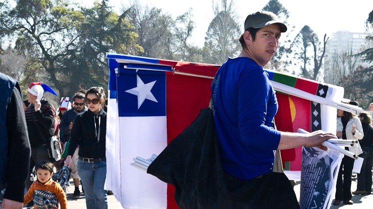 A man holds a chilean flag
