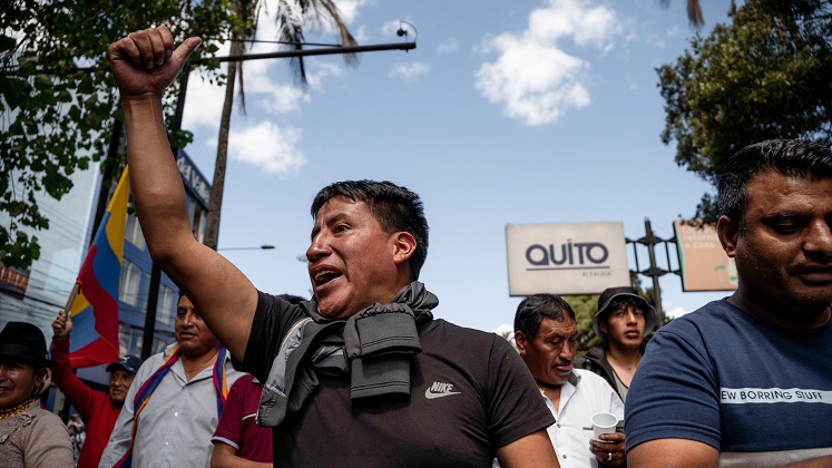A man protests in a demonstration in Ecuador in 2022