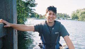 Photograph of Rhys in a lifejacket on the river