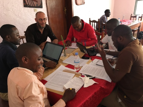 African and European researchers working around a table