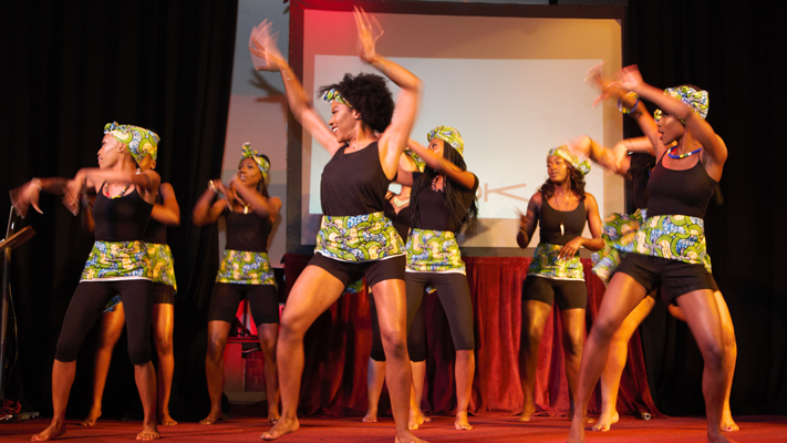 Women dancing on stage at Miss Congo Beauty Pageant