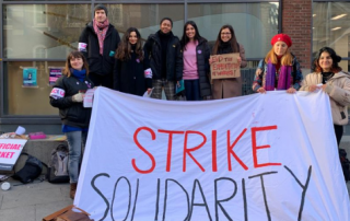 Photo of staff and students holding banner reading 'strike solidarity'