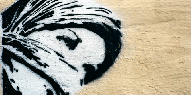 Graffiti image on wall of woman wearing a hijab