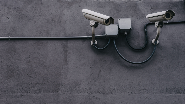 Surveillance cameras on a wall