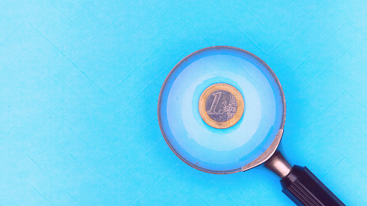 Magnifying glass on a 1 Euro coin