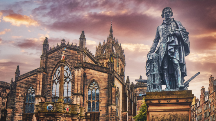 Statue of Adam Smith in front of St. Giles Cathedral on the Royal Mile in Old Town Edinburgh, Scotland 
