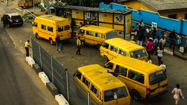 Danfos lining up on road to pick up passengers, Lagos, Nigeria