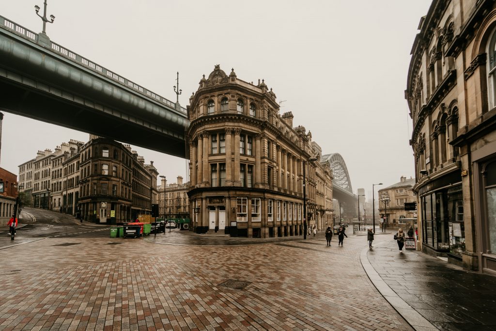 Street in Newcastle upon Tyne, with Tyne Bridge, UK