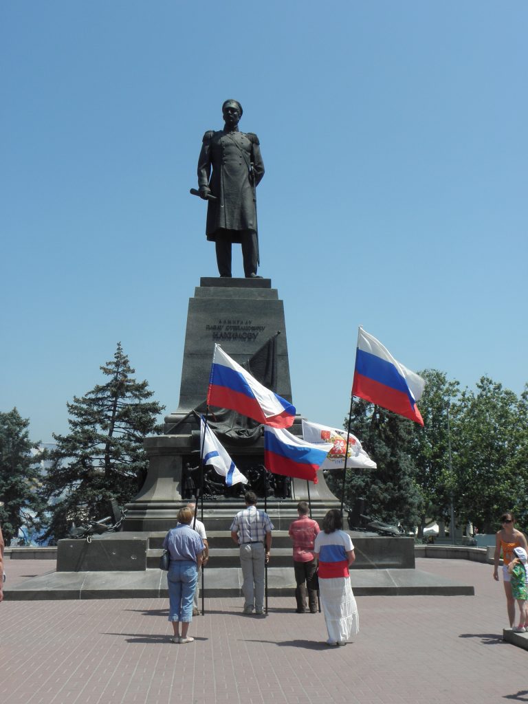 Five people holding Russian and other flags at a very small-scale pro-Russian march, Sevastopol, Crimea, Ukraine, 2011"