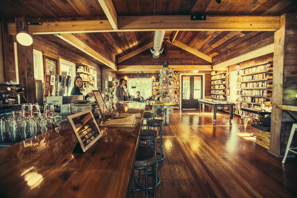 Interior of Wild Detectives bookshop, featuring a bar and bookshelves in the background