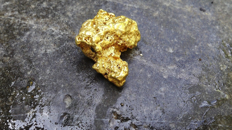 Gold nugget on rock