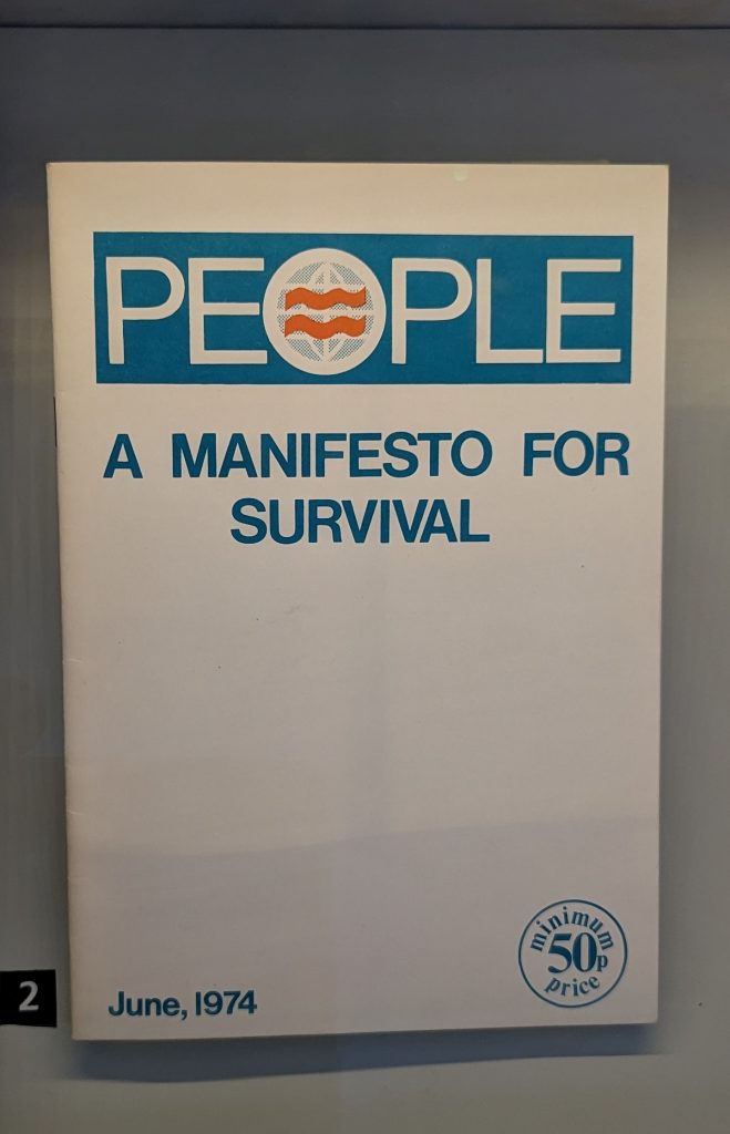 A photograph of a plain white pamphlet with the title ‘A Manifesto for Survival’. The party logo ‘PEOPLE’ appears along the top. 