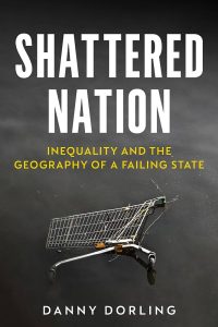 Book cover of Shattered Nation: Inequality and the Geography of A Failing State by Danny Dorling with a black background, white and yellow font and the image of a shopping trolley in the foreground.