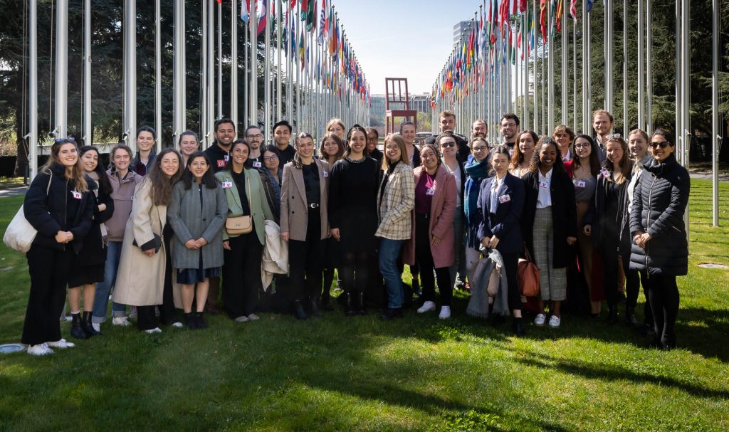 Group photo in front of Alley of Flags at the Palais des Nations