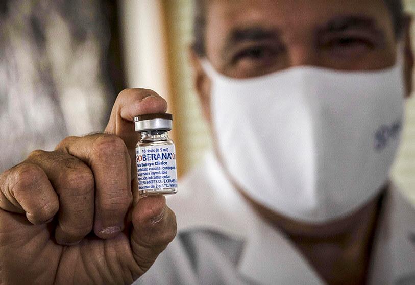  A doctor shows a vial of the experimental vaccine Soberana 02 for COVID-19 being developed at the Molecular Immunity Centre during a media tour of the facility's vaccine production in Havana, Cuba.