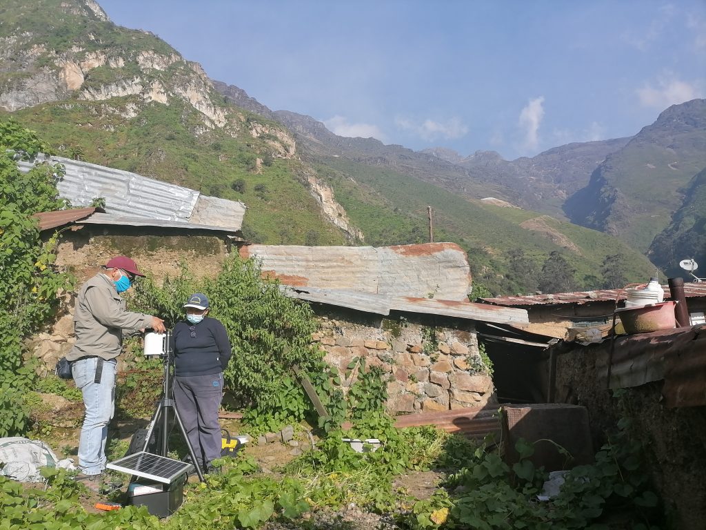 Practical Action staff and community member doing maintenance work on a solar powered early warning monitoring station in the Peruvian Andes. Photo by Practical Action. 