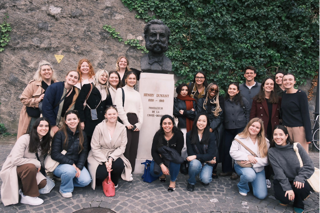 Group photo with the bust of Henry Dunant, founder of the Red Cross.