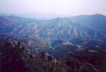 Looking down into the main Sheeam valley, January 2005. Villagers must cross the mountain range seen here in order to reach the township centre and the closest local market (Photograph by Catherine Ingram)