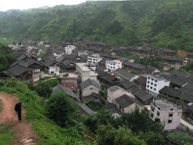 Looking down into the centre of the largest village in Sheeam, Jai Lao, July 2008. The top of the main dare low (“drum tower”) can be seen left of centre (Photograph by Catherine Ingram)