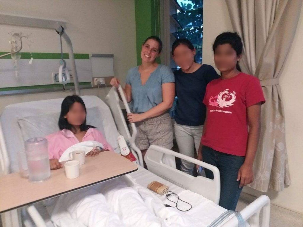 Another volunteer, shelter resident and I visited another resident who was in hospital after an operation. She had pins put in her pelvis and plates in her spine after falling from a building. She was able to send this photo to her concerned family in Myanmar for reassurance (photo author’s own, 2017).