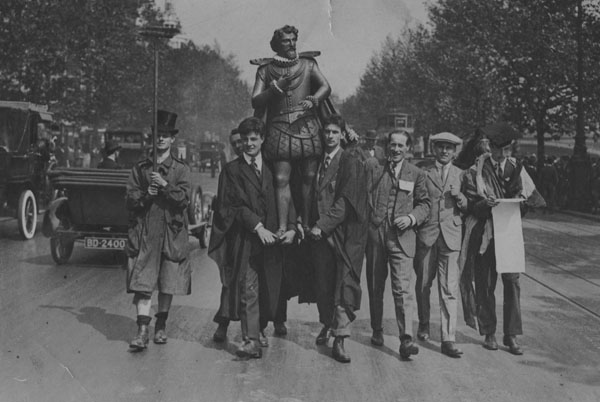 Students parading an effigy of Sir Walter Raleigh on the Embankment after the laying of the foundation stone in Houghton Street, 28 May 1920. left to right: William Ewart Green (LSE 1919-1922), Price (behind), Stanley Herbert Cair, Castell, William Willis, ?, George Grant Mackenzie. IMAGELIBRARY/935. LSE