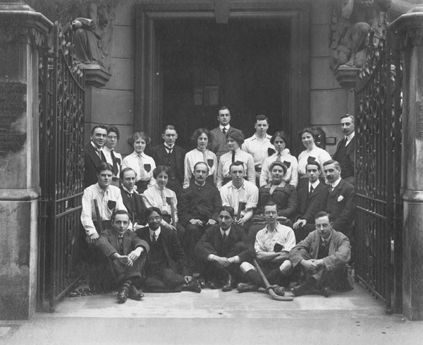 First LSE hockey team, 1911. Standing extreme left Percy Anstey, 6th from left, Margery Holman, seated from left Percy Holman, H B Lees-Smith, Vera Powell (later Anstey), William Pember Reeves (Director), front second from left N M Mazwundar (President of the Students Union). IMAGELIBRARY/1316. LSE