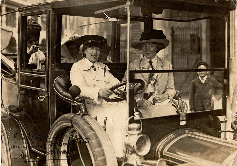 Vera 'Jack' Holme driving Emmeline Pankhurst (sitting in the back), Edith Craig (sitting in the front) and others to Scotland, 1909. 7VJH/5/ 2/04. LSE