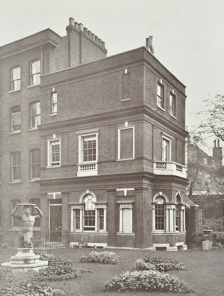 View of Clements Inn Garden House with sculpture and garden, 1885. London Met Archives 169515.