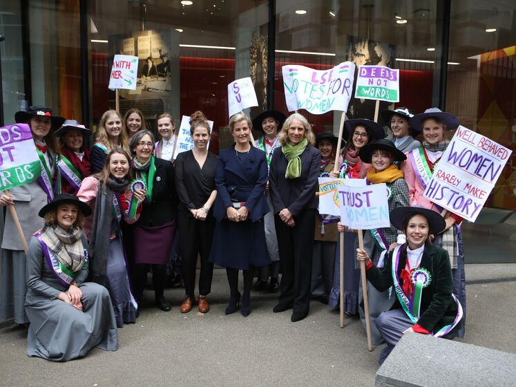 HRH Countess of Wessex (Centre) Helen Pankhurst, Caroline Emma Criado-Perez and Professor Julia Black pose for a group portrait with LSESU Women in Politics Society dressed as suffragettes outside the newly named Pankhurst House in Clement's Inn on 23 November 2018. LSE/Nigel Stead