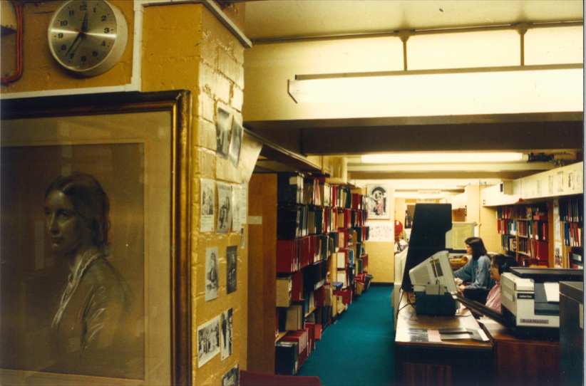 A photo of the desk at the Women's Library, City of London Polytechnic in Old Castle Street. Includes a portrait of Josephine Butler in the foreground. 