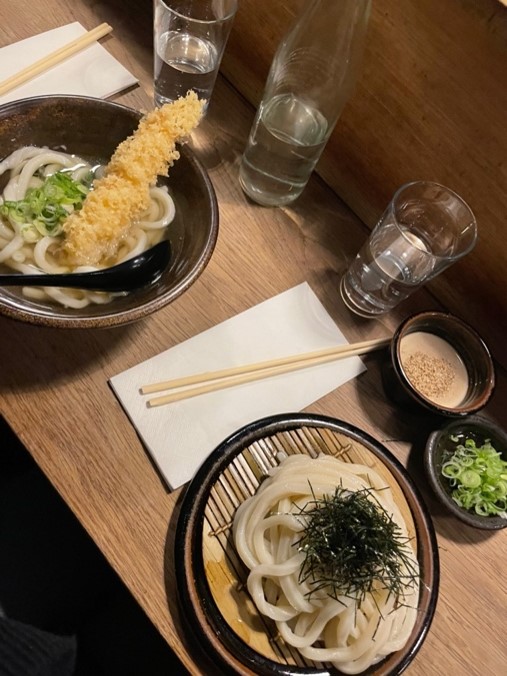 one bowl and one plate of japanese food with napkin and chopstick on table at the restaurant Koya Soho
